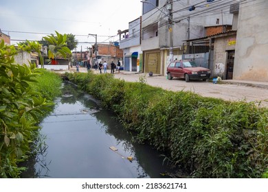 Jardim Pantanal, São Paulo, SP, Brazil, JUL 27, 2022, Unpaved Streets Beside A Small River In A Poor Community In The Wetland Region