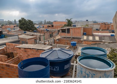 Jardim Pantanal, São Paulo, SP, Brazil, JUL 27, 2022, Drums Of Water Accumulated On The Terrace Of Houses In The Poor Community