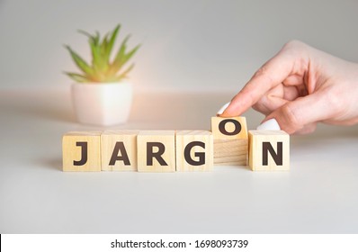 Jargon - hand holding word from wooden blocks with letters, special words and phrases jargon concept, top view on white background.