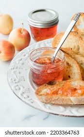 Jars Of Crab Apple Jelly With Some On A Slice Of Toasted Sourdough Bread