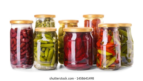 Jars With Different Canned Vegetables And Legumes On White Background