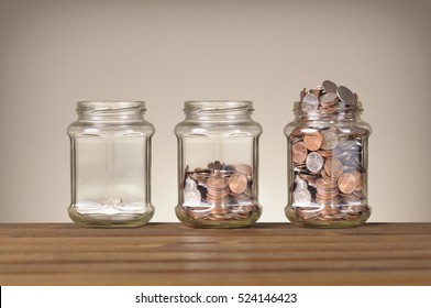 jars with different level of coins - Powered by Shutterstock