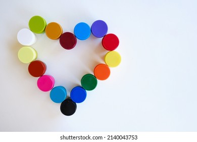 Jars With Multi-colored Paints In The Shape Of A Heart. Creative Background. Paint For Drawing. Love Postcard. Mock Up