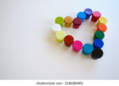 Jars With Multi-colored Paints In The Shape Of A Heart. Creative Background. Paint For Drawing. Love Postcard. Mock Up
