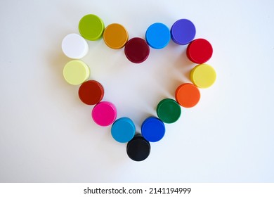 Jars With Multi-colored Paints In The Shape Of A Heart. Creative Background. Paint For Drawing. Love Postcard. Mock Up