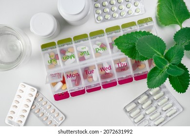 Jars Of Pills And Water. Pill Box With Pills For Morning And Evening. Open Pill Box With Pills Or Vitamins For Senior Patient