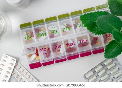 Jars Of Pills And Water. Pill Box With Pills For Morning And Evening. Open Pill Box With Pills Or Vitamins For Senior Patient