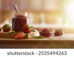 Jars with strawberry jam on wooden and fruit around on a wooden table and rustic kitchen background. Front view.