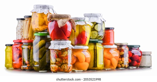 Jars with variety of marinated vegetables and fruits. Preserved food - Shutterstock ID 2053521998
