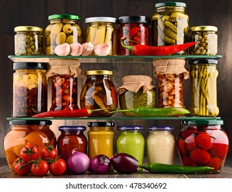 Jars with variety of pickled vegetables. Preserved food - Shutterstock ID 478340692