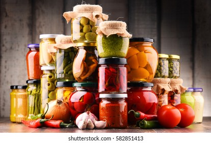 Jars with variety of pickled vegetables. Preserved food - Shutterstock ID 582851413