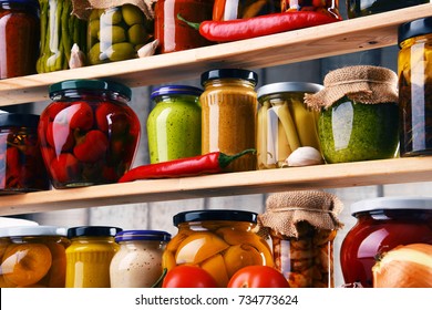 Jars with variety of pickled vegetables. Preserved food - Shutterstock ID 734773624