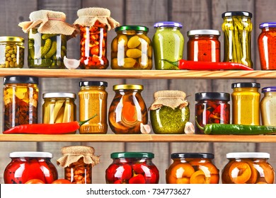 Jars with variety of pickled vegetables. Preserved food - Shutterstock ID 734773627