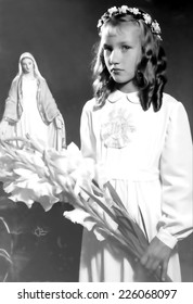 JASLO,POLAND - CIRCA 1953: Vintage Photo Of Girl Receiving First Holy Communion