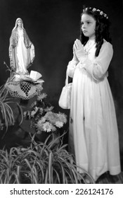 JASLO,POLAND - CIRCA 1955 : Vintage Photo Of Girl Receiving Firdt Holy Communion 