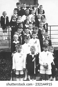 JASLO,POLAND - CIRCA 1960 : Vintage Photo Of Boys Receiving First Holy Communion