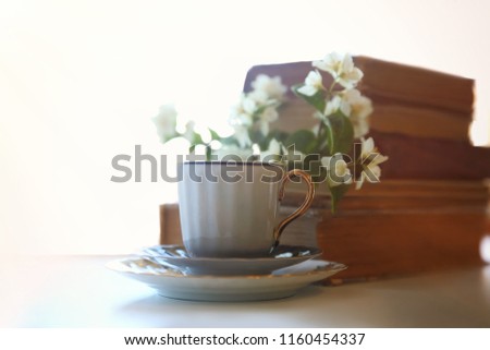 Similar – Still life with cup of tea at the window