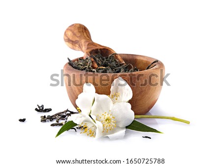 Jasmine flowers and green tea  on a white background. Green tea with jasmine. Herbal medicine.