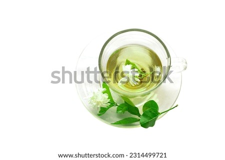 jasmine tea, jasmine green tea in a set of tea cups on a white background Decorate. the plate with fresh jasmine flowers adds fresh fragrance. Soft and selective focus.                                