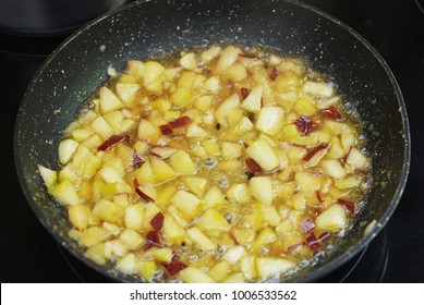 Java Apple Pieces, Sugar and Syrup in a Pan, ready for being boiled. Cooking Apple Jam.
