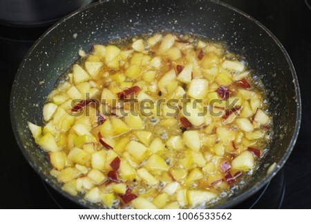 Java Apple Pieces, Sugar and Syrup in a Pan, ready for being boiled. Cooking Apple Jam.