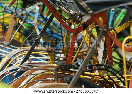 Java Indonesia rickshaws Caption: Pile of colourful scrapped cycle rickshaw frames, Java, Indonesia 