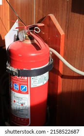 Java, May 2022. Portable fire extinguisher installed and ready to use in the navigational bridge accommodation of supply ship. weekly routine test and check for live saving appliance and fire fighting