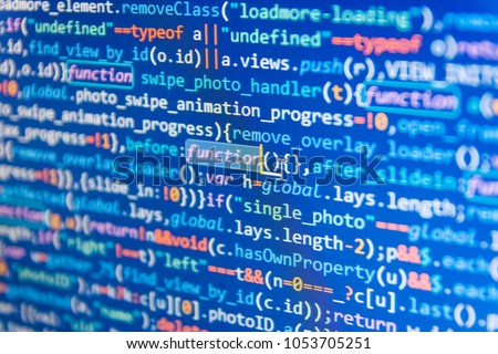 Javascript code in bracket software. Programmer typing new lines of HTML code. Script procedure creating. Big data database app. Website codes on computer monitor. 