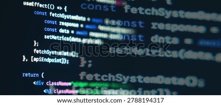 JavaScript React frontend code with fetch API syntax displayed on a dark monitor screen