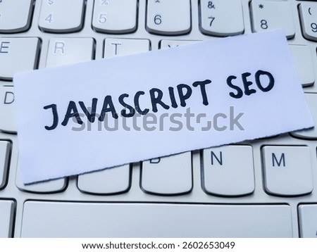 Javascript seo writting on laptop keyboard background.