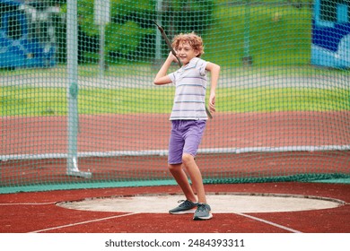 Javelin throw competition for kids. Athletics club training in school. Little boy throwing javelin on school stadium. Young athlete exercising. Healthy sport outdoor. - Powered by Shutterstock