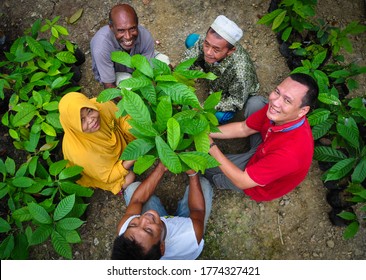 Jayapura, Papua, Indonesia - March, 2020: Local People With Different Background Working Together To Develop Agricultural Practices For Sustainable Livelihoods In Papua. It's Unity In Diversity.