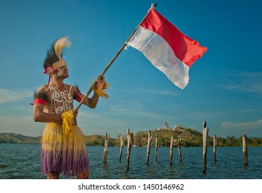 jayapura Papua Indonesia, a portrait of an adult male raising a red and white flag, January 19, 2011