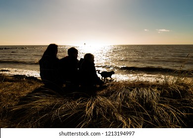 Jaywick, Clacton On Sea, Essex - 1st August 2018 - A Silhouette Of A Family Looking Out To Sea At Sunset 