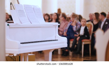 A Jazz Concert In The Concert Hall. Piano On The Foreground And Audience On A Background