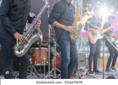 Jazz festival. Saxophone, music instrument played by saxophonist player musician in fest.