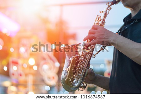 jazz festival. Saxophone, music instrument played by saxophonist player musician in fest.