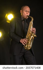 Jazz Man Playing A Gold Saxaphone