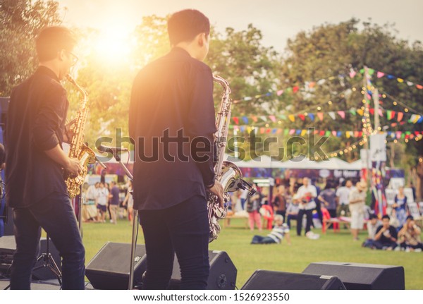 jazz musician playing
outdoor concert	