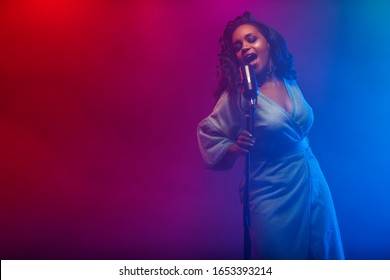 A Jazz Singer Performs On Stage. Afro.