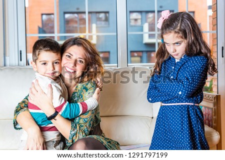 Jealous girl to see her brother hug her mother