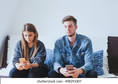 Jealous Man Husband Spying Wife, Suspicious Boyfriend Trying To Read Messages On The Mobile Phone Of His Girlfriend While She Is Not Watching
