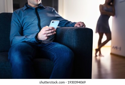 Jealous woman and cheating man with a phone. Infidelity, jealousy and betrayal. Cheater husband texting with mistress and secret lover. Suspicious wife peeking and spying. Unfaithful sneaky boyfriend.
