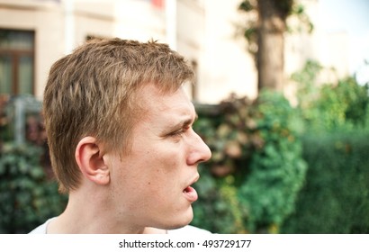 Jealousy Young Man.  Man Stalking Someone In The Park.