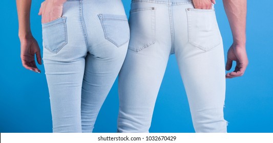 Jeans Fashion Always Fashionable. Man And Woman In White Jeans On Blue Background. Beautiful Jeans Emphasize Shapes. Jeans It For Everyone, Of Any Age, Always In Style. Couple In Love Holding An Ass