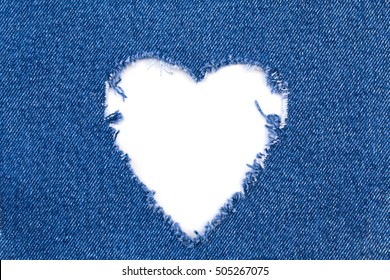 Jeans Heart Frame Hole. Destroyed torn denim blue jeans frayed flap patch fabric on white background