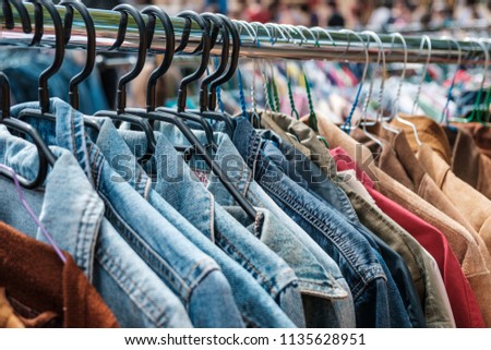 Jeans jackets and retro shirts on second hand market /  flea market - vintage clothing -