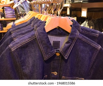 jeans jacket.with blue jeans on the hanger . for sale in the shop

