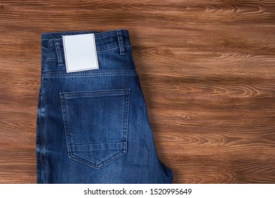 Jeans Label Mockup, Denim Texture, Isolated Wooden Background