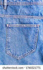 Jeans Pocket Texture Closeup. Blue Denim With Yellow Stitching